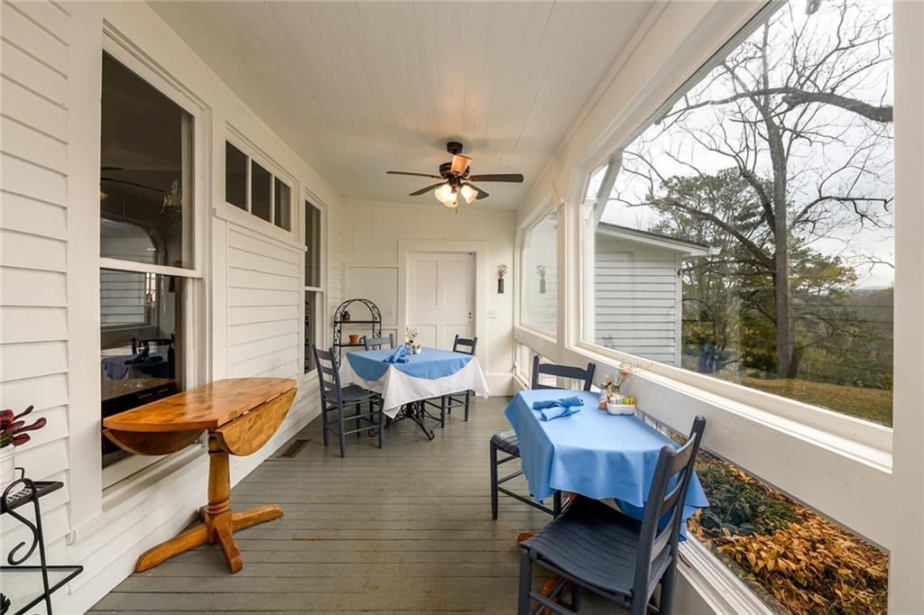 1526 Highway 255 Sautee Nacoochee, GA 30571 - Photo 8 of 61 a living room with furniture a rug and a floor to ceiling window