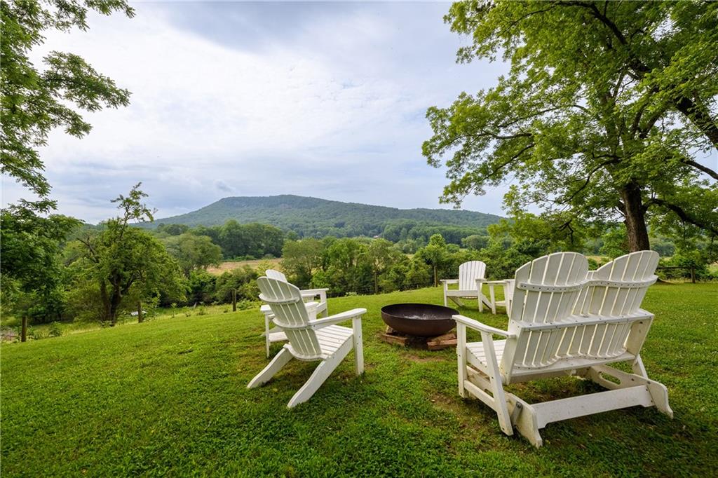 1526 Highway 255 Sautee Nacoochee, GA 30571 - Photo 10 of 61 a view of a chair and table in the garden