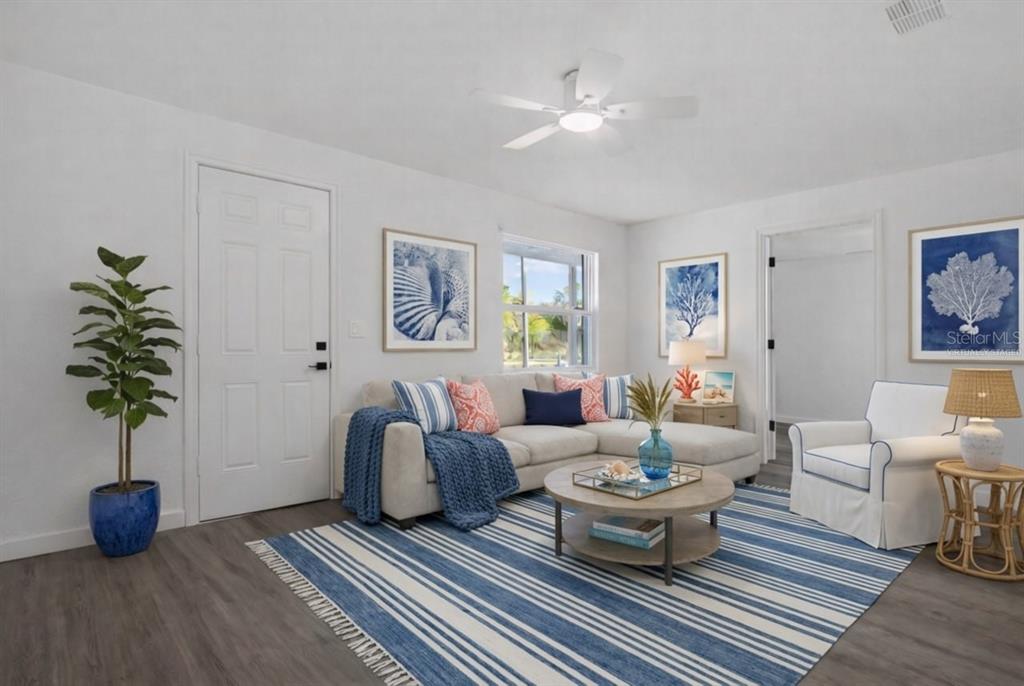 1955 Gilbert Street Clearwater, FL 33765 - Photo 14 of 24 a living room with furniture and a potted plant