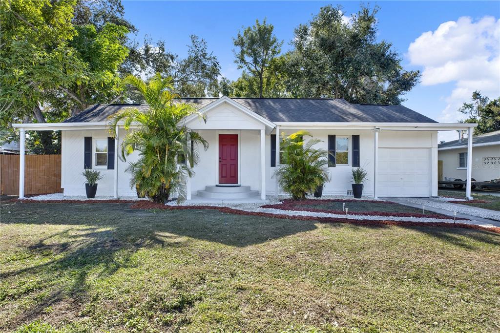 1955 Gilbert Street Clearwater, FL 33765 - Photo 18 of 24 front view of a house with a yard