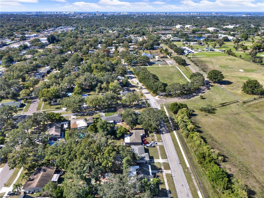1955 Gilbert Street Clearwater, FL 33765 - Photo 19 of 24 an aerial view of residential houses with outdoor space and trees