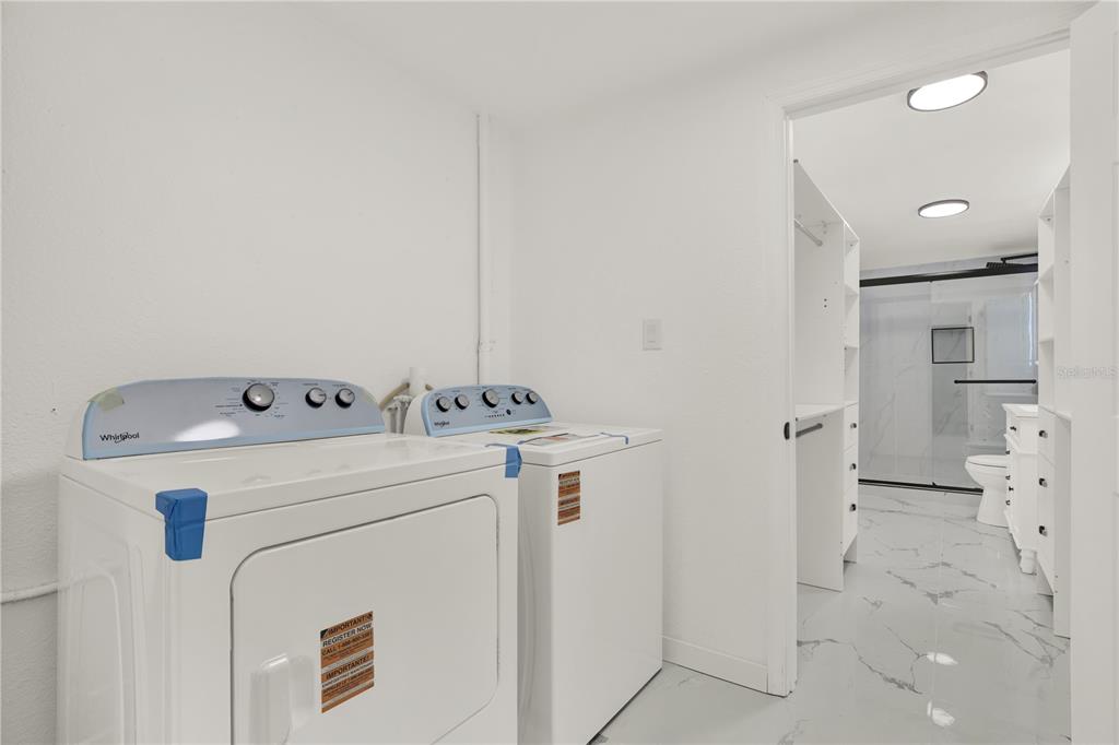 1955 Gilbert Street Clearwater, FL 33765 - Photo 10 of 24 a utility room with dryer and washer