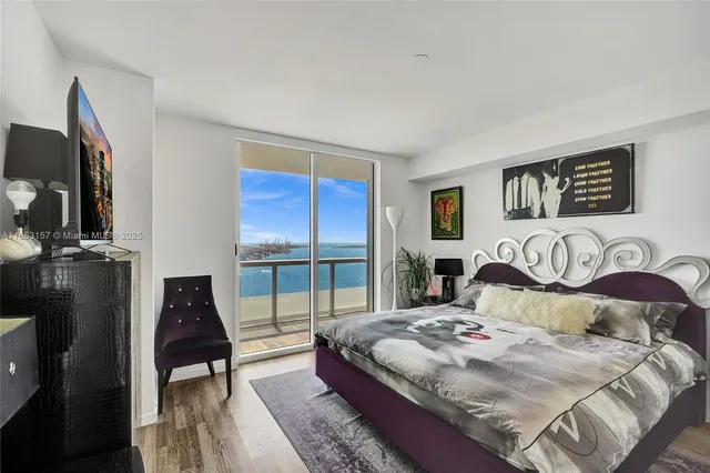 a bedroom with bed and a window