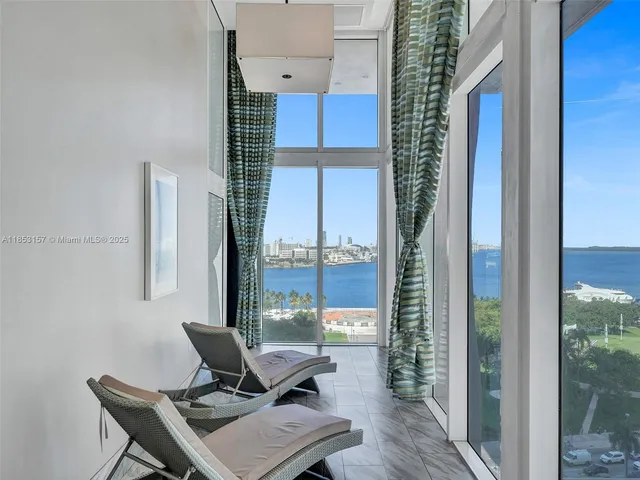 a view of a backyard with sitting area