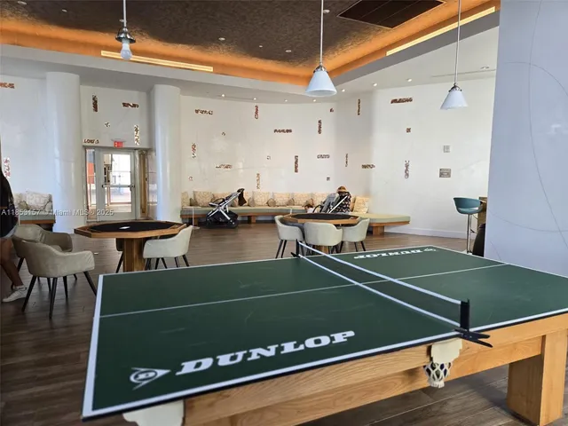 a workspace room with furniture and wooden floor