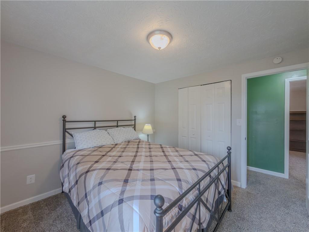 5728 Salem Road Lithonia, GA 30038 - Photo 18 of 35 a bedroom with a bed and a mirror