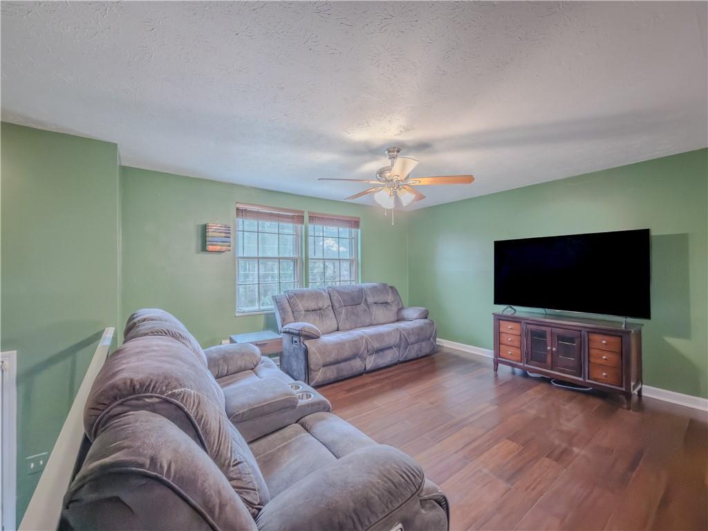 5728 Salem Road Lithonia, GA 30038 - Photo 6 of 35 a living room with furniture and a flat screen tv