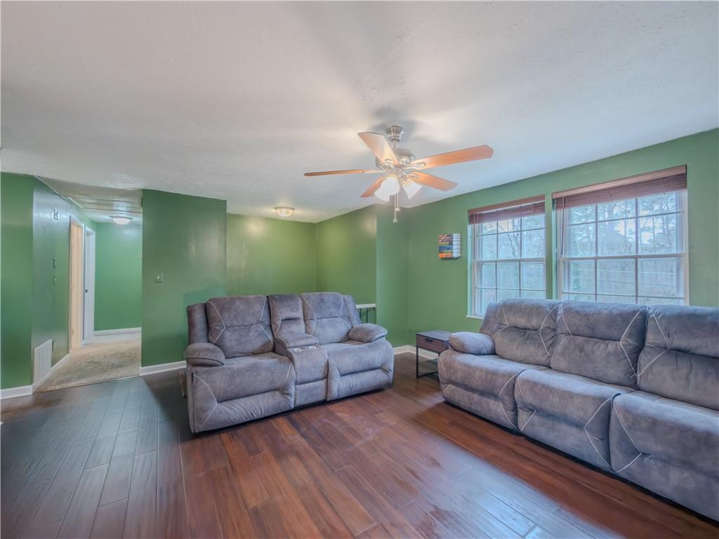 5728 Salem Road Lithonia, GA 30038 - Photo 7 of 35 a living room with furniture and a wooden floor