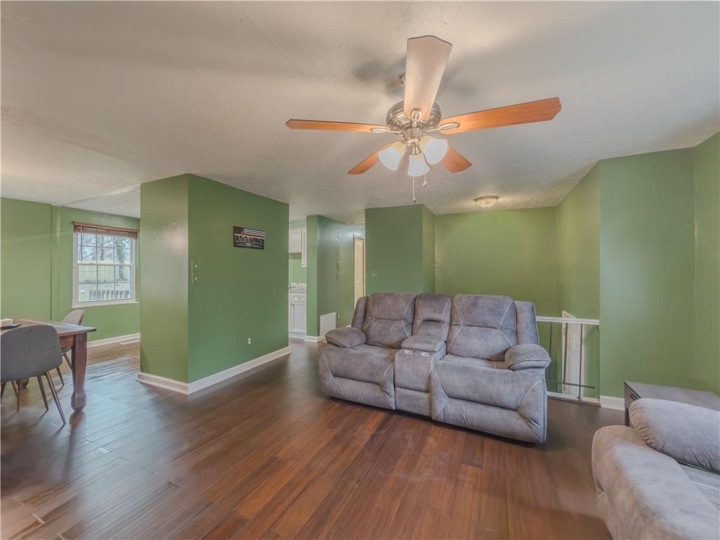 5728 Salem Road Lithonia, GA 30038 - Photo 8 of 35 a living room with furniture and a wooden floor