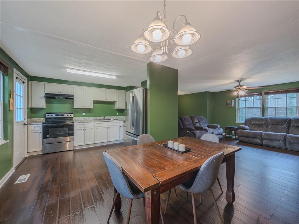 5728 Salem Road Lithonia, GA 30038 - Photo 10 of 35 a view of a dining room with furniture and wooden floor