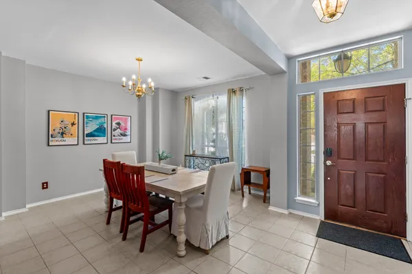 a view of a dining room with furniture window and outside view