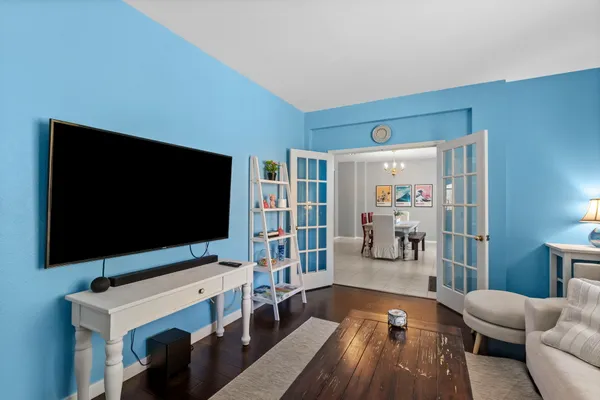 a living room with furniture and a large window