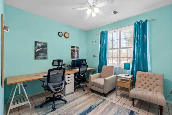 a work room with furniture and windows