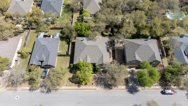 an aerial view of waterside residential houses with outdoor space