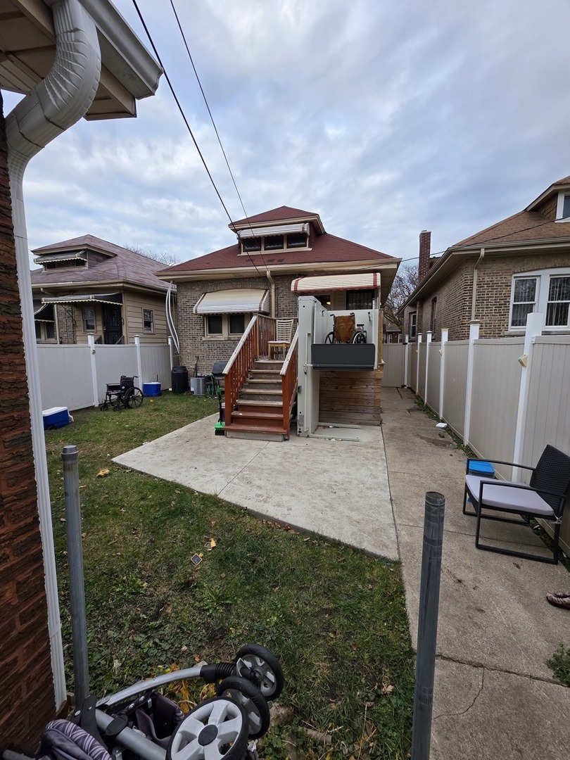 9250 South Ada Street Chicago, IL 60620 - Photo 15 of 16 a house view with a backyard space
