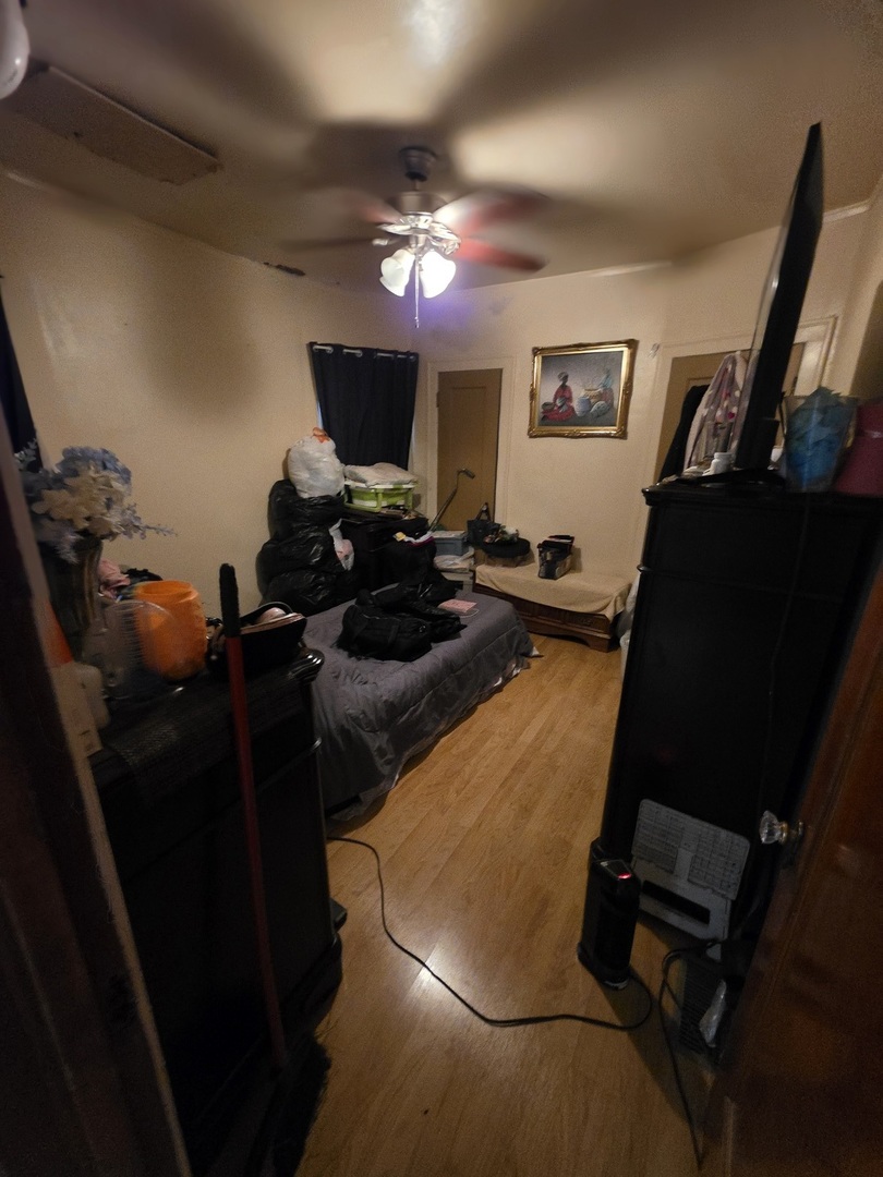 9250 South Ada Street Chicago, IL 60620 - Photo 6 of 16 a room with furniture and a flat screen tv