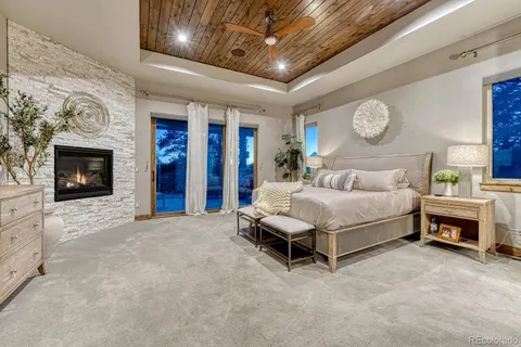 a bedroom with bed and a flat screen tv