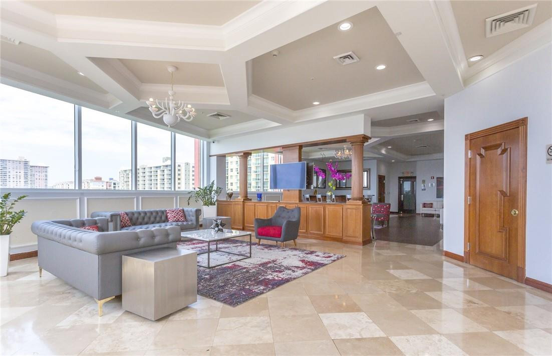16900 North Bay Road, Unit 3514 Sunny Isles Beach, FL 33160 - Photo 15 of 27 a living room with furniture and a flat screen tv
