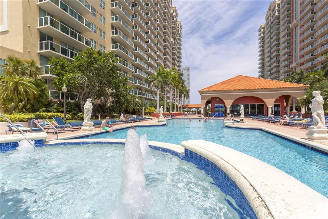 16900 North Bay Road, Unit 3514 Sunny Isles Beach, FL 33160 - Photo 23 of 27 a view of swimming pool with lawn chairs and plants