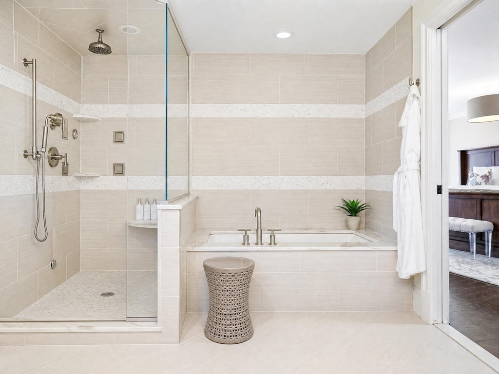 85 Old Farm Road Milton, MA 02186 - Photo 17 of 42 a bathroom with a bathtub and a shower