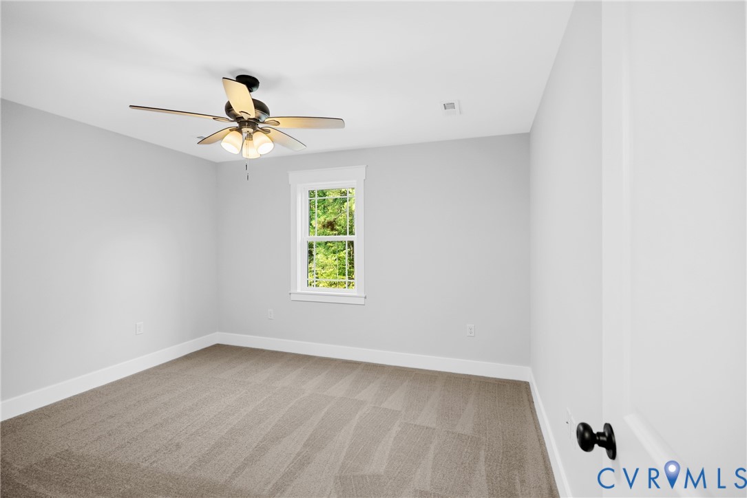 19106 Carson Road Dinwiddie, VA 23841 - Photo 20 of 34 Upstairs bedroom (1) Neutral wall paint, carpet fl