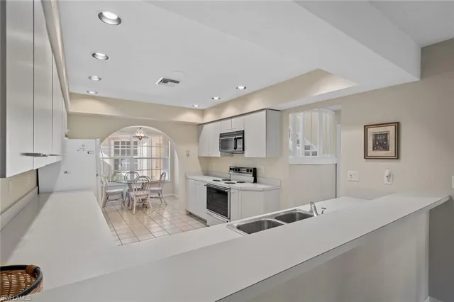 a view of a kitchen with furniture and a window