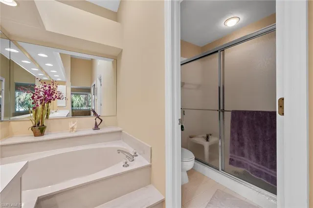 a bathroom with a tub and shower