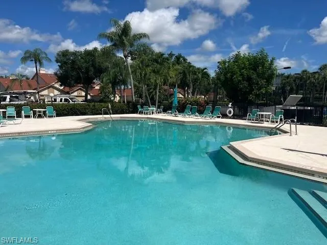 a view of a fountain in front of a house