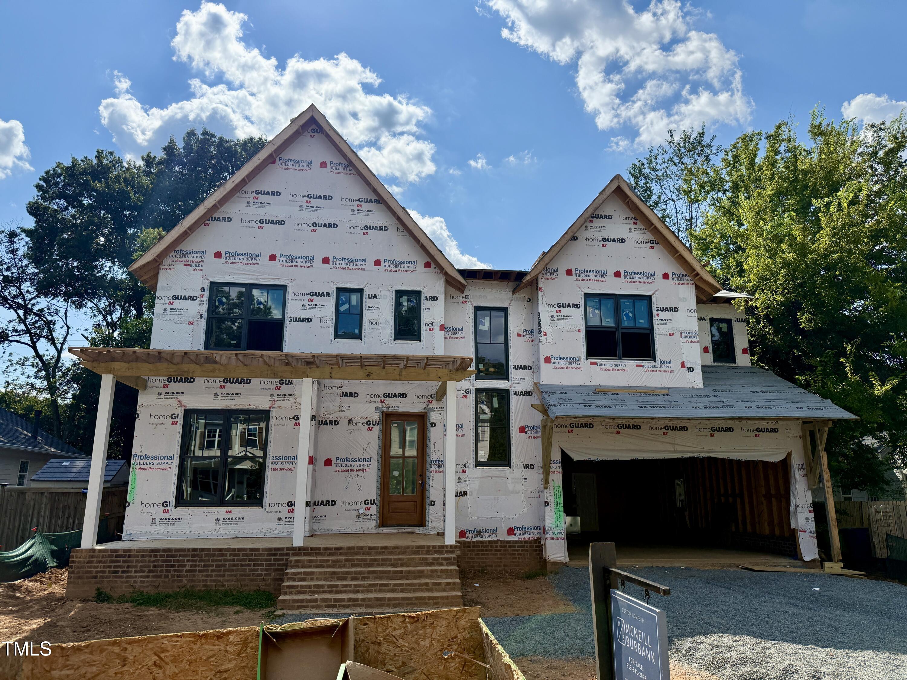 1807 Ridley Street Raleigh, NC 27608 - Photo 1 of 14 a front view of a house with a yard