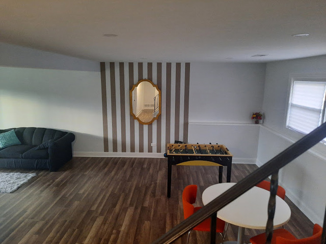 1106 Busse Road Mount Prospect, IL 60056 - Photo 18 of 27 a view of a hallway with wooden floor and staircase