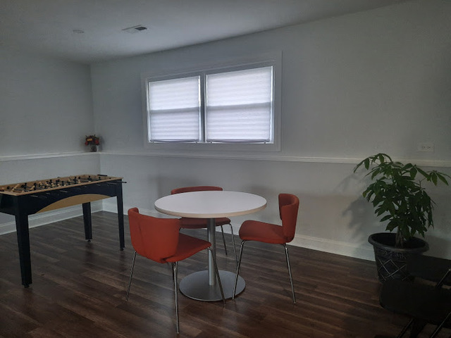 1106 Busse Road Mount Prospect, IL 60056 - Photo 19 of 27 a room with furniture and a potted plant
