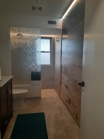 1106 Busse Road Mount Prospect, IL 60056 - Photo 20 of 27 a bathroom with a bathtub and a shower