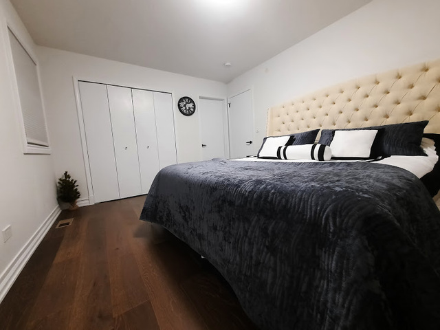1106 Busse Road Mount Prospect, IL 60056 - Photo 10 of 27 a spacious bedroom with a bed and a window
