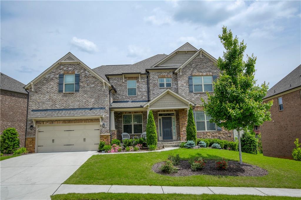 2525 Maple Ridge Lane Cumming, GA 30041 - Photo 1 of 1 Three sided brick home with bed/bath on main in swim/tennis community.