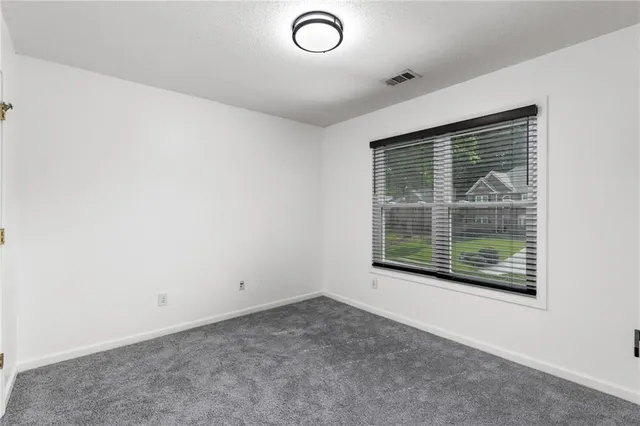 a view of a room that has a large window