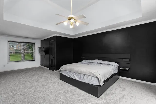 a bedroom with a chandelier and a chandelier