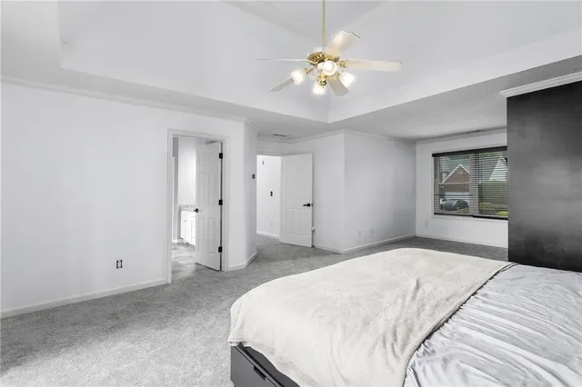 a spacious bathroom with a granite countertop tub sink and mirror