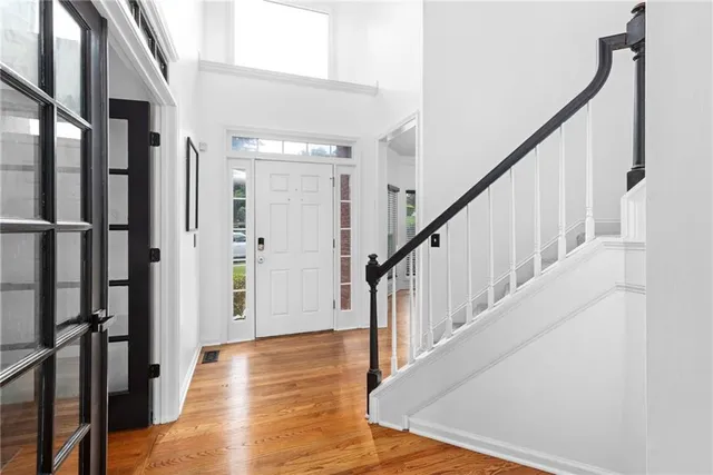 a view of an entryway with wooden floor