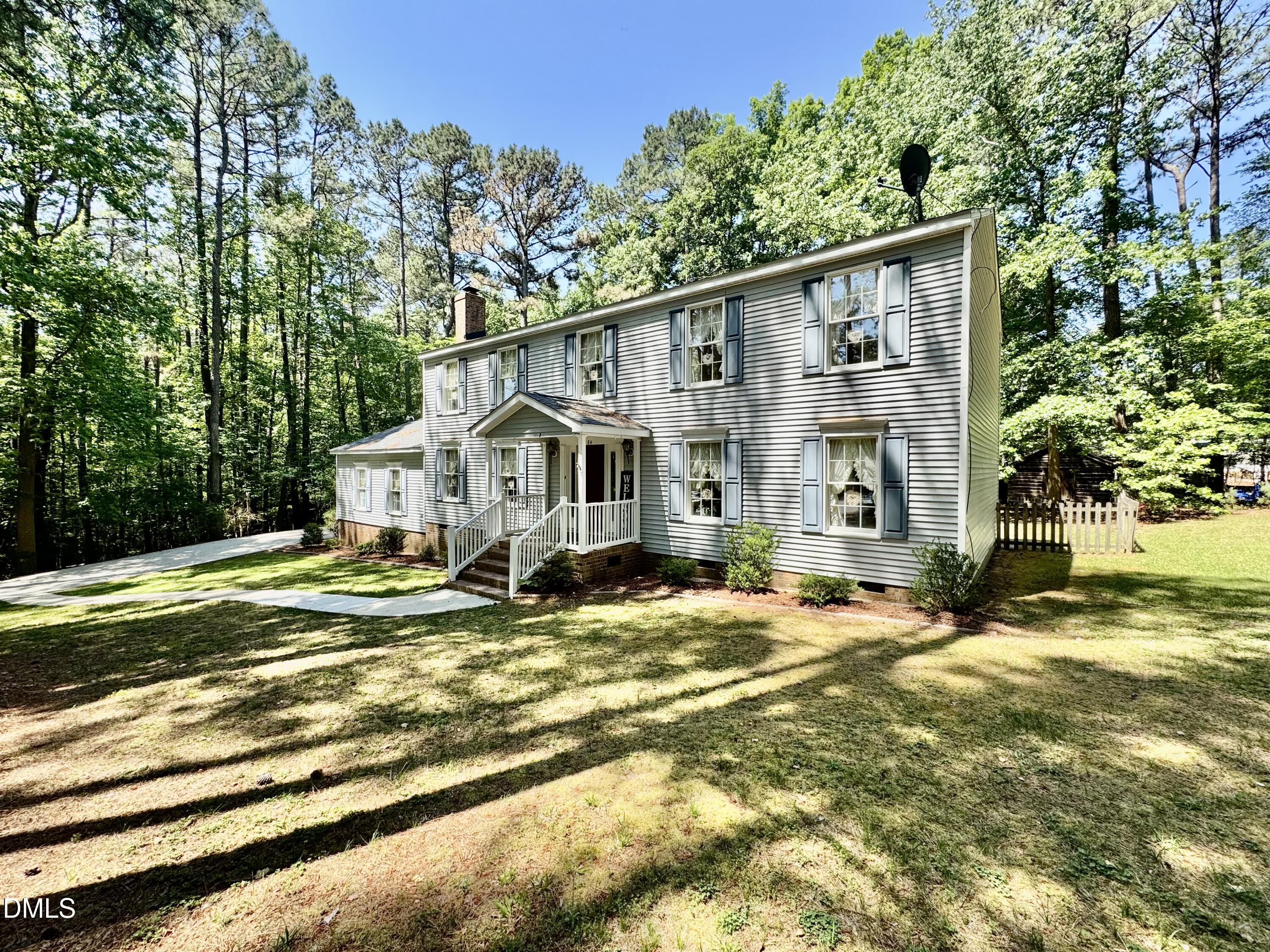 84 Wintergreen Road Henderson, NC 27537 - Photo 2 of 49 a view of a house with a yard