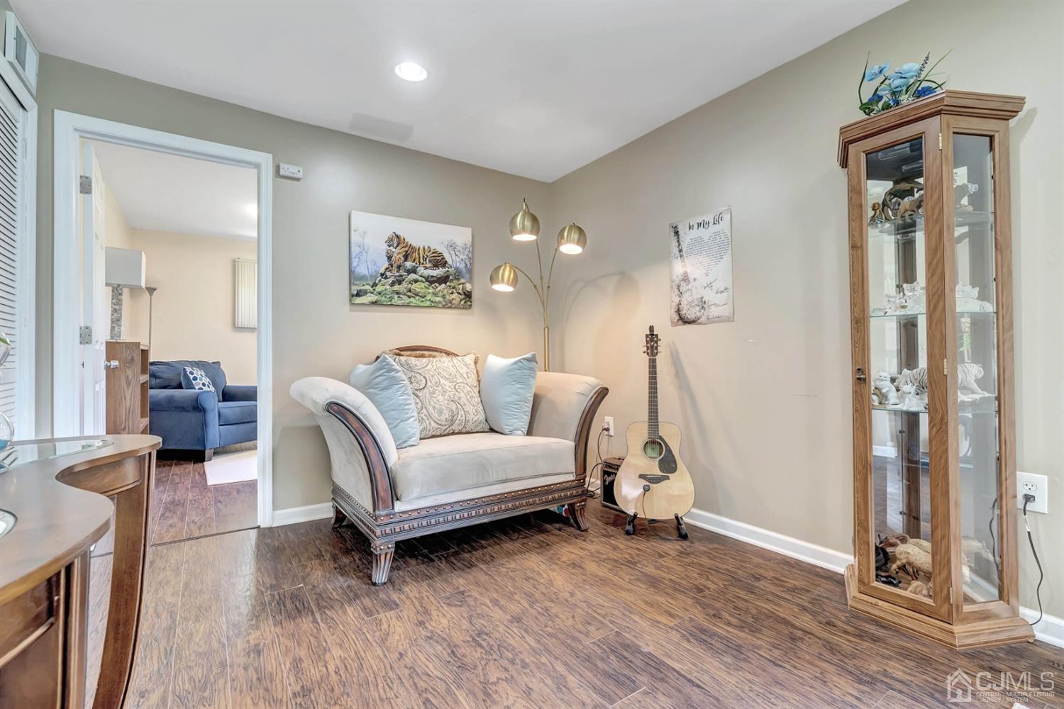 30 West Knollwood Road Edison, NJ 08817 - Photo 15 of 17 a living room with furniture and a wooden floor