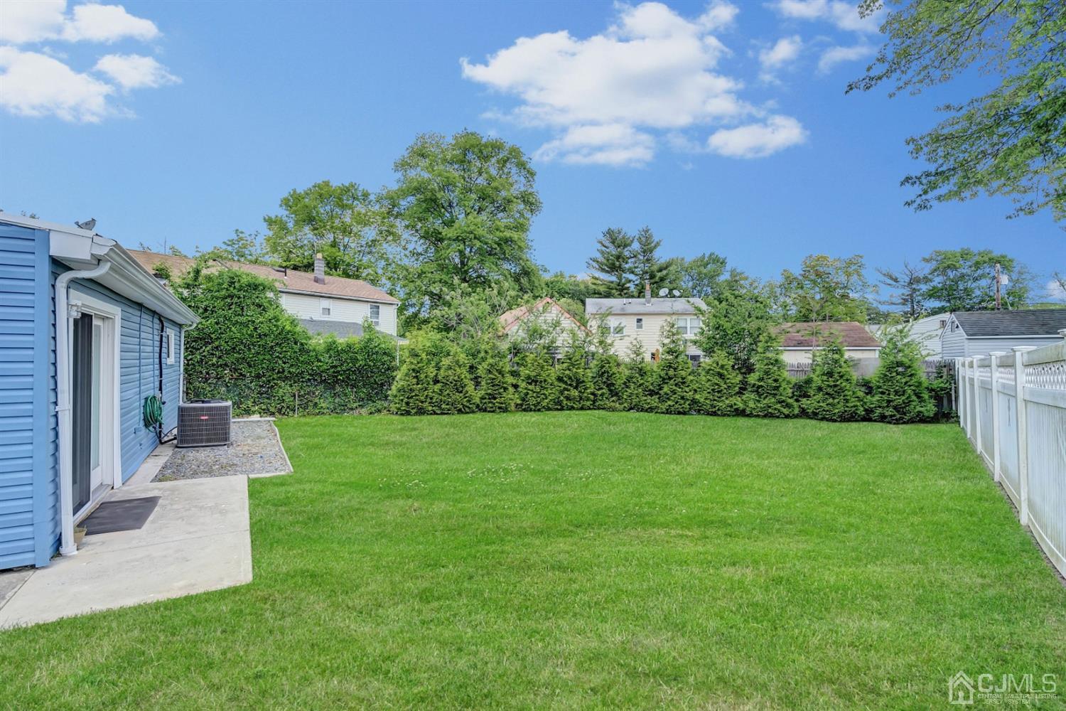 30 West Knollwood Road Edison, NJ 08817 - Photo 17 of 17 a view of a backyard with a garden