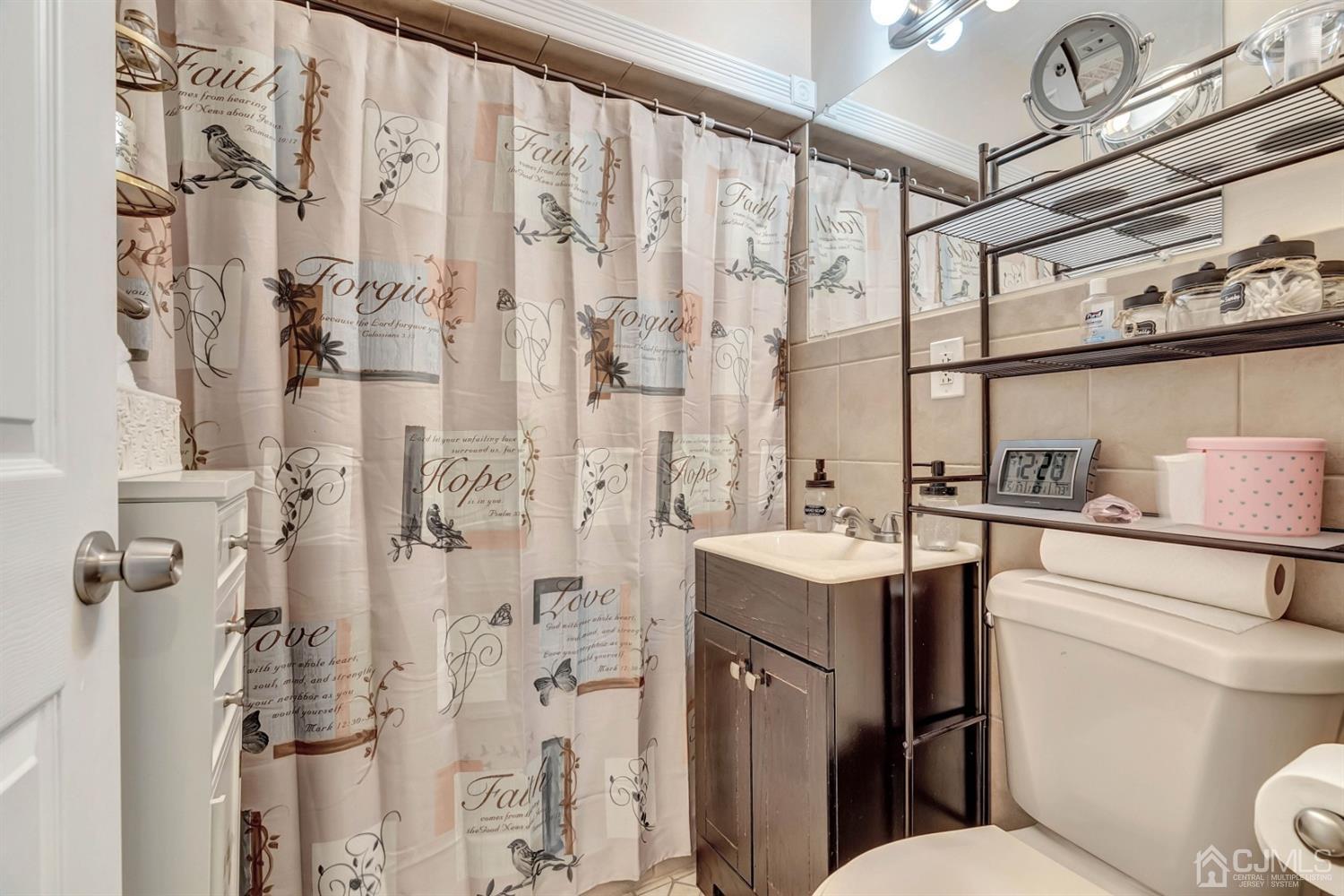 30 West Knollwood Road Edison, NJ 08817 - Photo 4 of 17 a bathroom with a sink toilet and shower