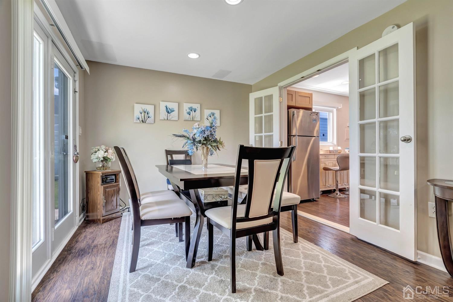 30 West Knollwood Road Edison, NJ 08817 - Photo 9 of 17 a view of a dining room with furniture and wooden floor