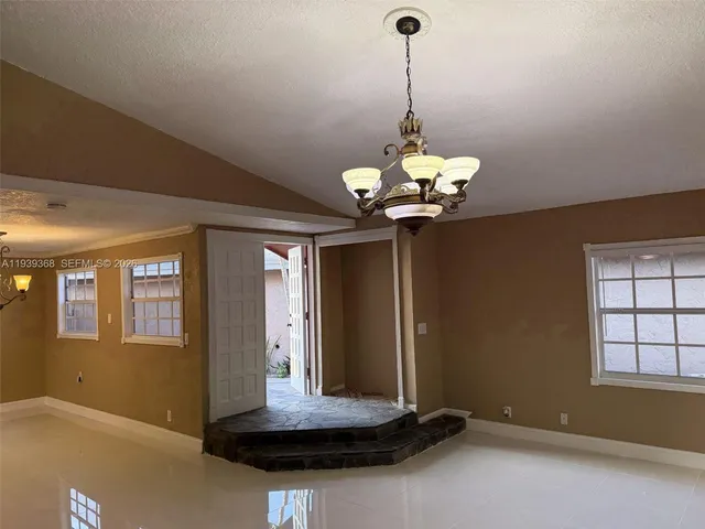 a view of a room with a chandelier