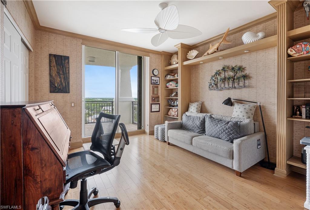 455 Cove Tower Drive, Unit 1101 Naples, FL 34110 - Photo 23 of 49 a living room with furniture and a flat screen tv