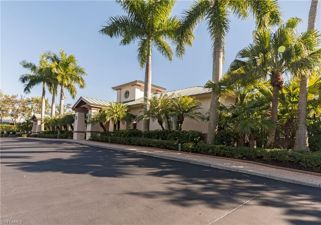 455 Cove Tower Drive, Unit 1101 Naples, FL 34110 - Photo 36 of 49 a front view of house with palm trees
