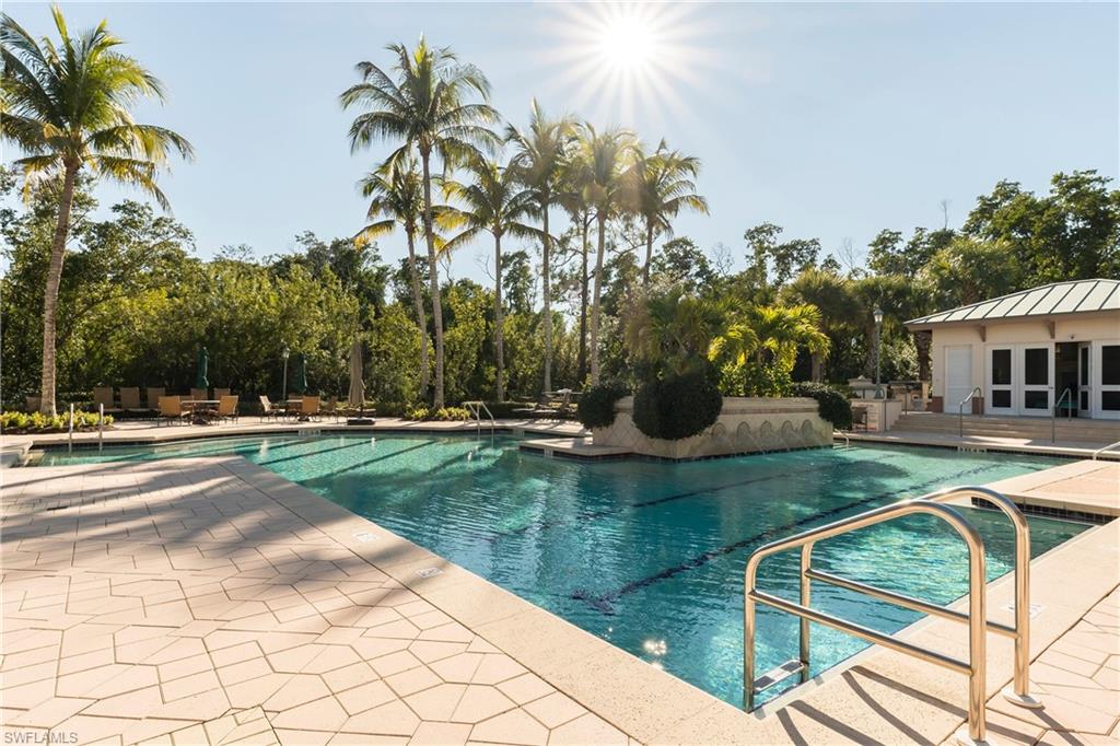 455 Cove Tower Drive, Unit 1101 Naples, FL 34110 - Photo 38 of 49 a view of a swimming pool with a patio