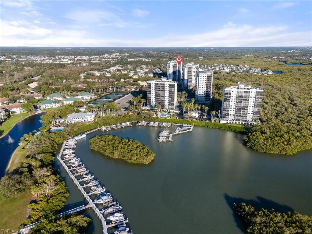 455 Cove Tower Drive, Unit 1101 Naples, FL 34110 - Photo 46 of 49 a view of a city with tall buildings