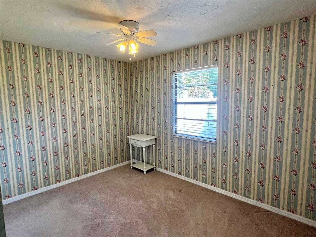 352 Southwest 85th Avenue Okeechobee, FL 34974 - Photo 18 of 21 a view of a room with a window and a fan