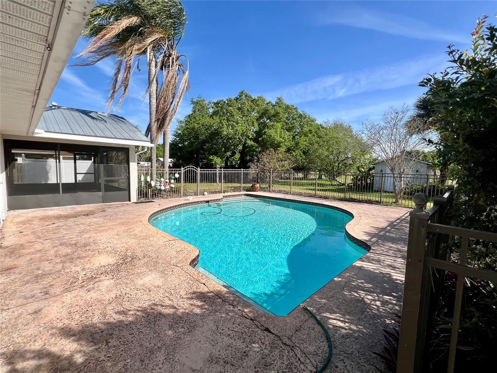 352 Southwest 85th Avenue Okeechobee, FL 34974 - Photo 5 of 21 a view of a swimming pool with a yard